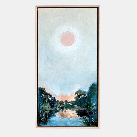 Framed artwork of a serene landscape with a pink moon over a reflective body of water.